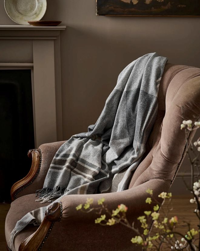 Flannel, cashmere soft wool throw draped over a chair in a Quebec living room
