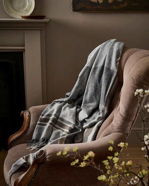 Flannel, cashmere soft wool throw draped over a chair in a Quebec living room