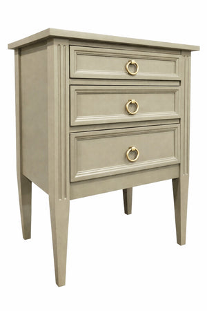 Beige nightstand with three drawers and gold handles on a white background