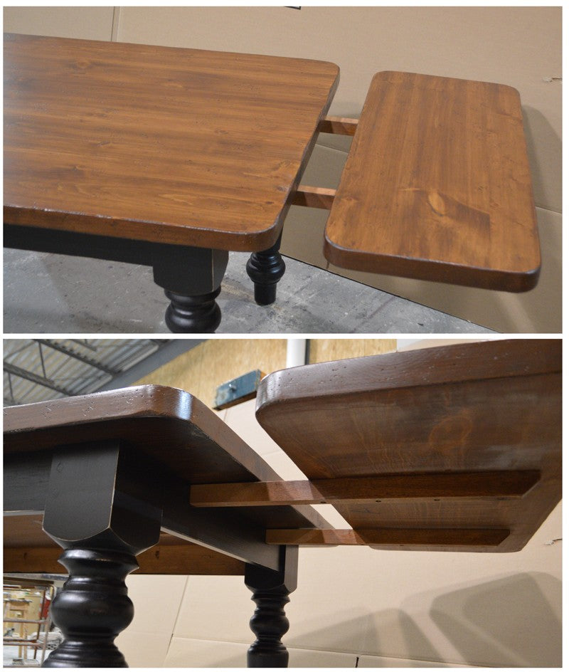 Wooden table with a folding leaf on a tiled floor.