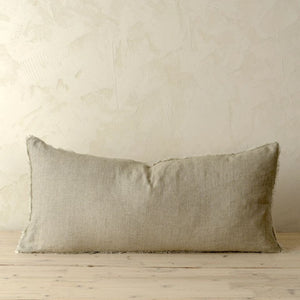 sand rectangle cushion on a neutral backdrop