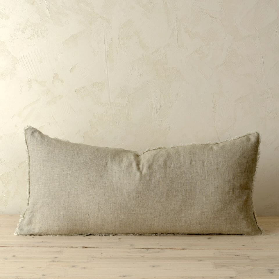 sand rectangle cushion on a neutral backdrop
