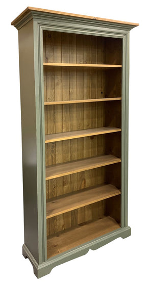 Tall wooden bookshelf with green painted frame and wooden shelves 